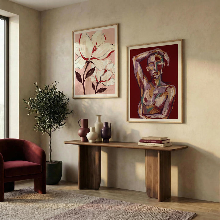 Abstract Figure and Floral wall art set showing an abstract female figure with bold colours above a wooden console in a living room