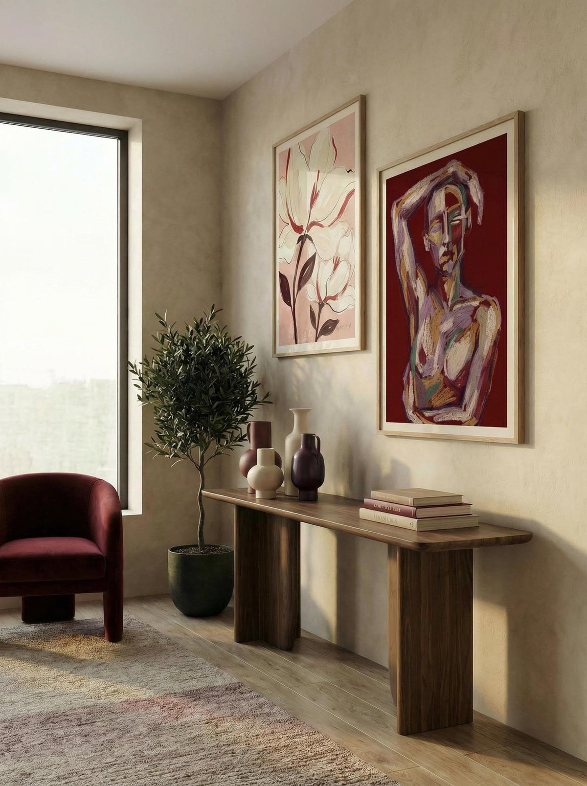 Print on a wall of an abstract female figure in red and pink tones with a plant beside in a living room