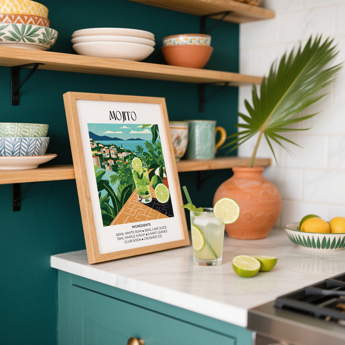Cocktail Print leaning on a kitchen counter with a mojito cocktail glass and lime slices nearby