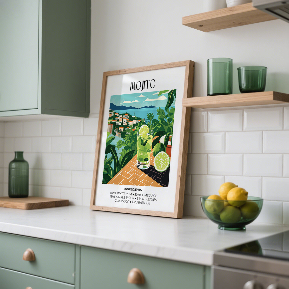Cocktail print leaning on a kitchen counter with green and white glassware and a bowl of lemons