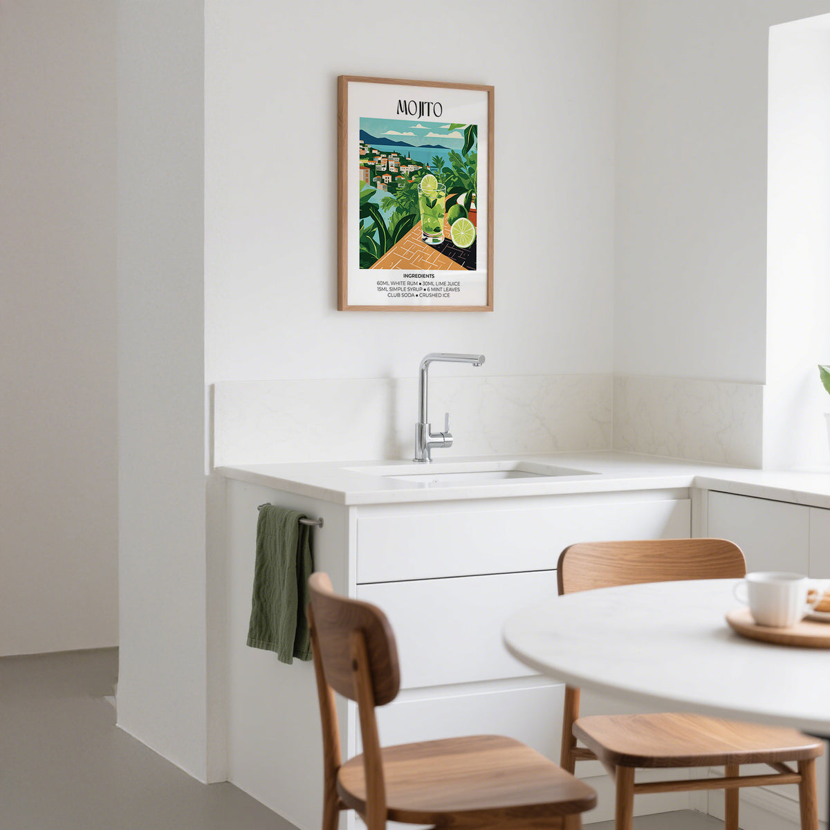 Cocktail print of a mojito glass illustration in green and blue hung in a bright kitchen above a sink