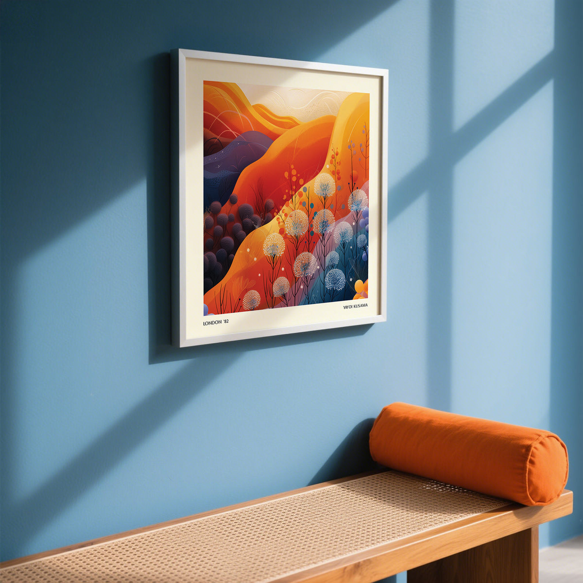 Art Print Square wall art of a mountain landscape with dandelions in warm oranges and blues above a bench with an orange cushion