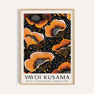 Framed orange print of stylized flowers with white dots on black background