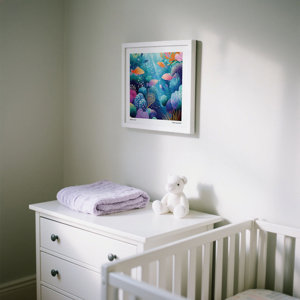 Coral Reef wall art with colourful fish and coral above a white chest of drawers and beside a crib