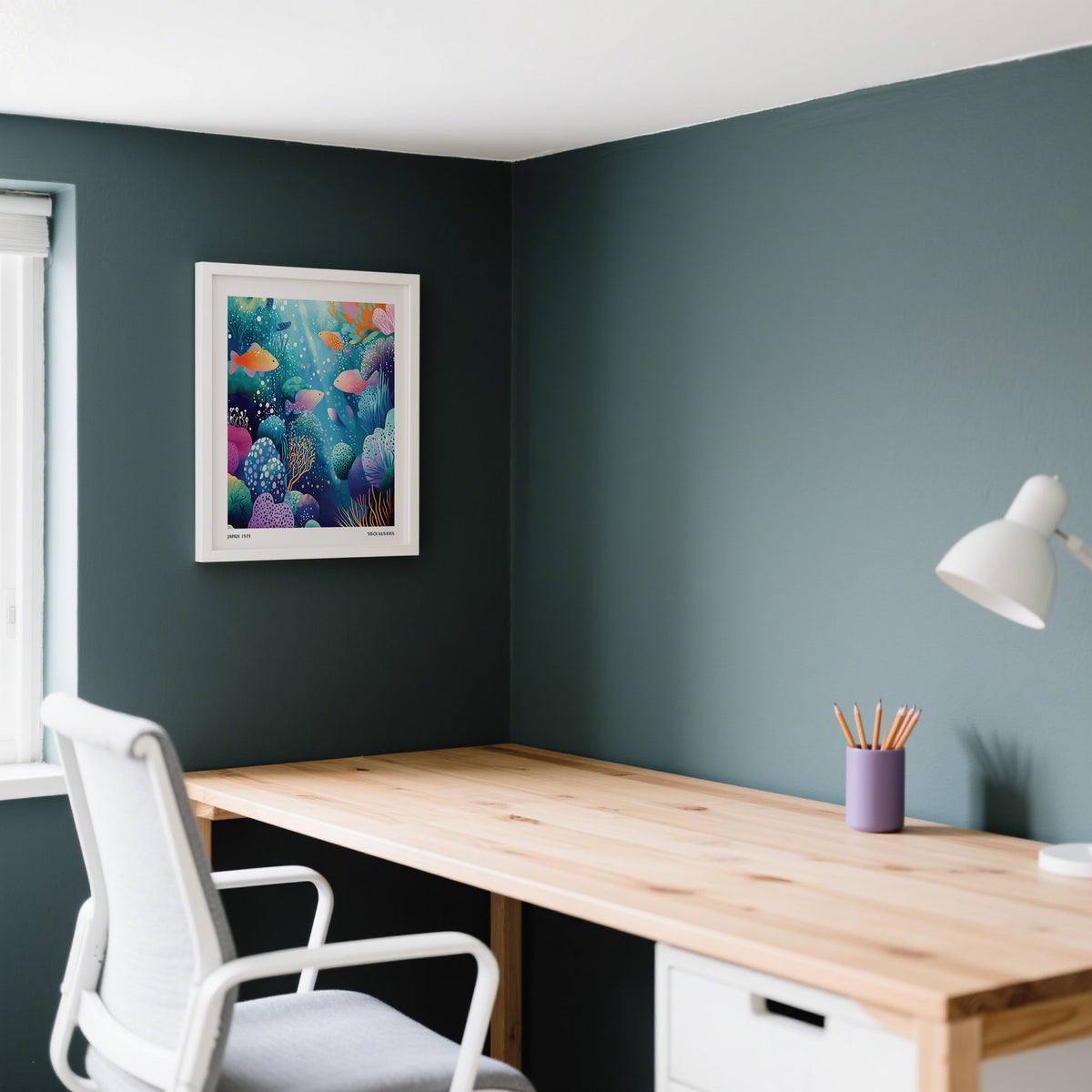 Coral Reef wall art of colourful fish underwater in a white frame above a wooden desk