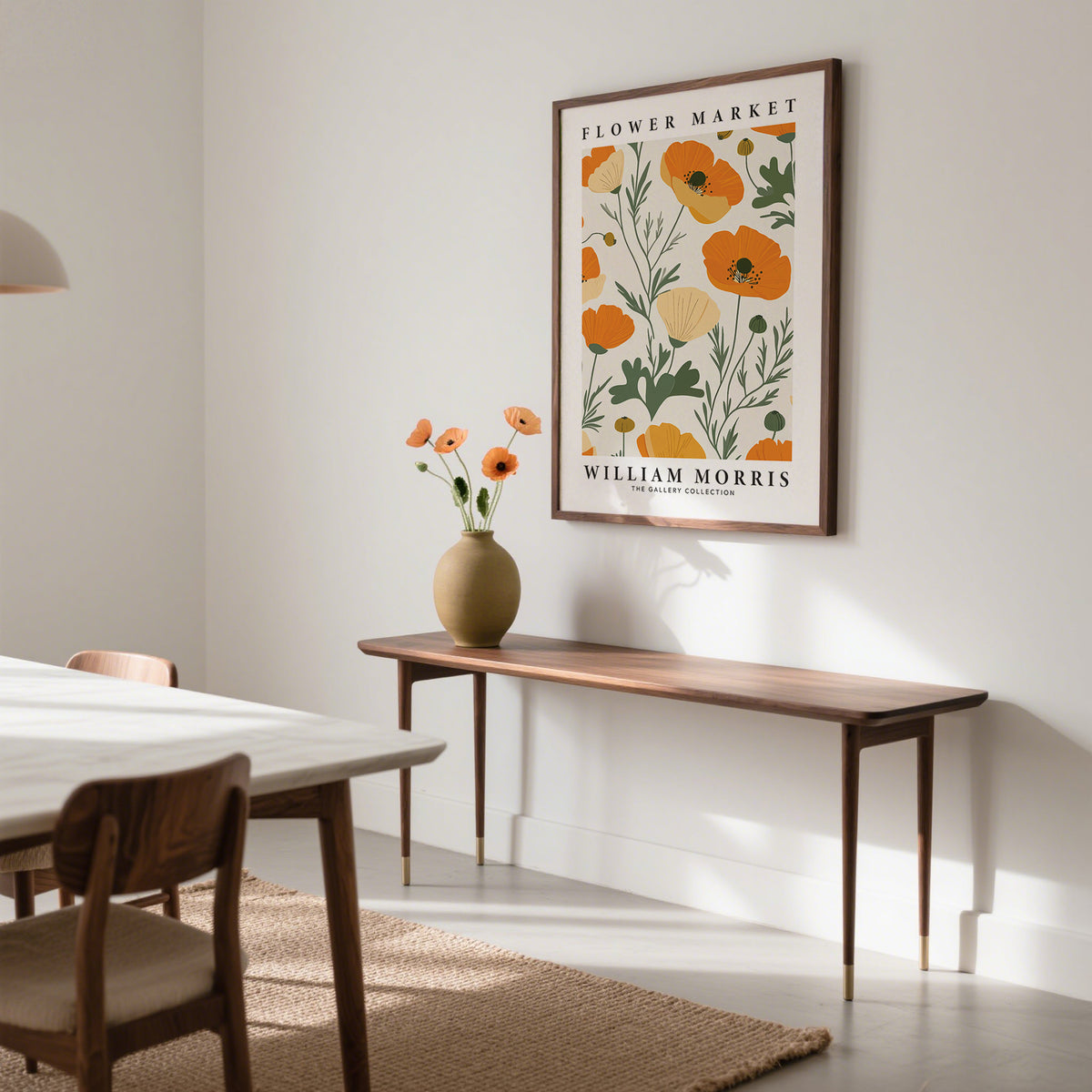 Wall Art Poppies framed print of orange poppies above a slim wooden console table in a minimalist room