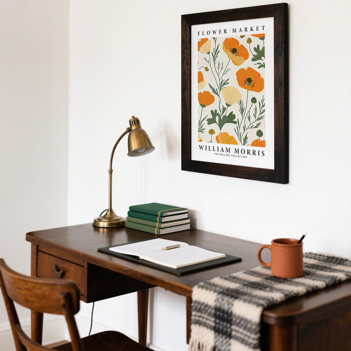 Wall Art Poppies framed print with orange poppy flowers above a wooden desk in a room