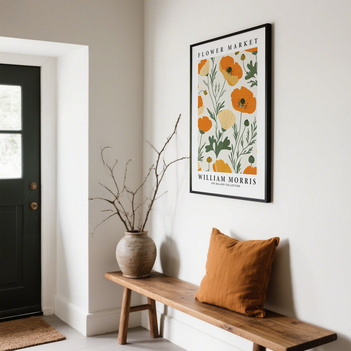 Wall Art Poppies with orange flowers in a black frame above a wooden bench with a terracotta cushion