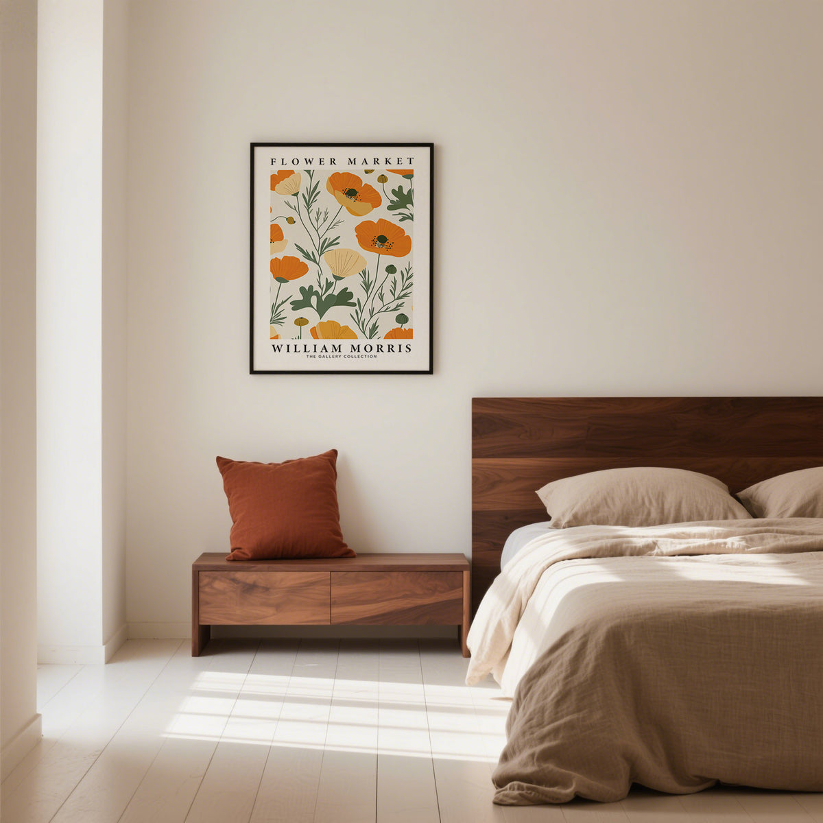Wall art poppies in black frame showing orange and cream minimalist flowers above wooden bedside table with orange cushion