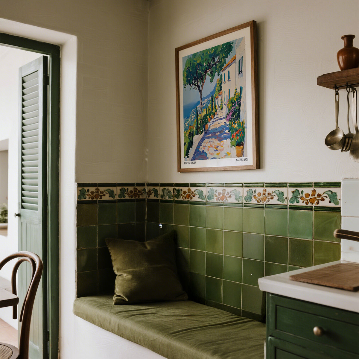 Prints of Amalfi Coast framed print of a Mediterranean path with bright green trees above a green tiled bench in a kitchen