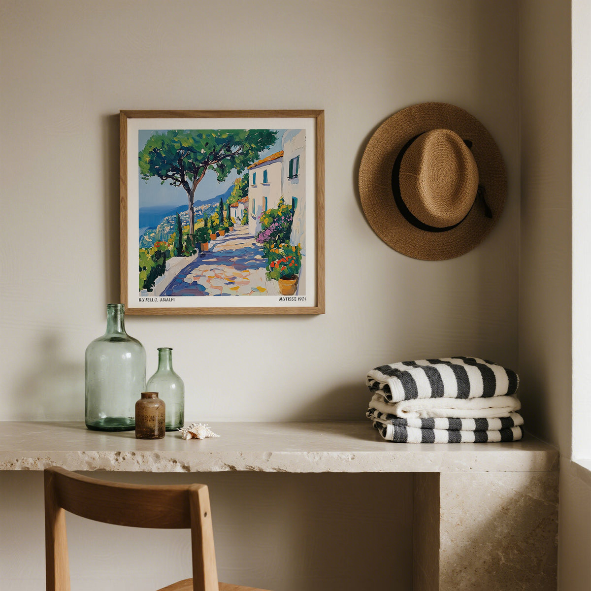 Prints of Amalfi Coast print of a Mediterranean path with trees and houses in watercolour style above a desk with glass bottles