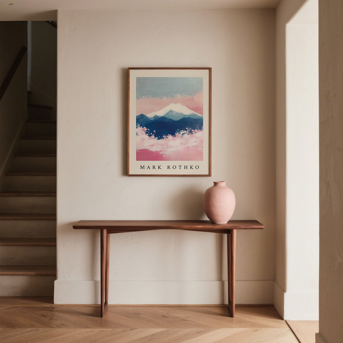 Mount Fuji Art framed print with pink and blue abstract snow-capped mountain above wooden console with a pink vase