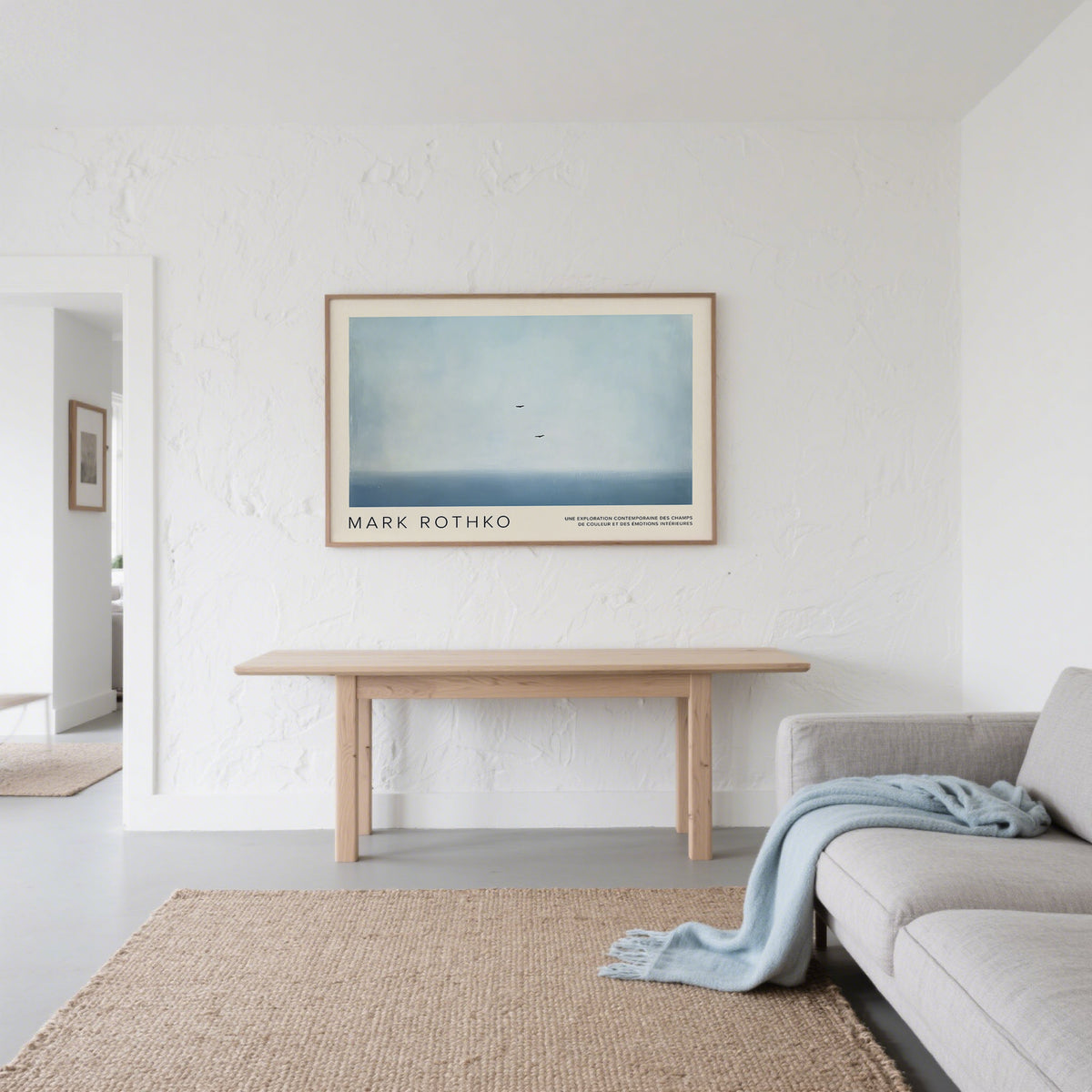 Wall Art Light Blue showing two birds above a blue horizon in a minimalist style above a wooden table