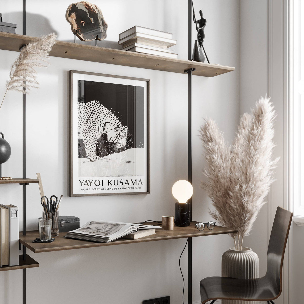 White Tiger wall art with black and white minimalist illustration above a desk with lamp and pampas grass