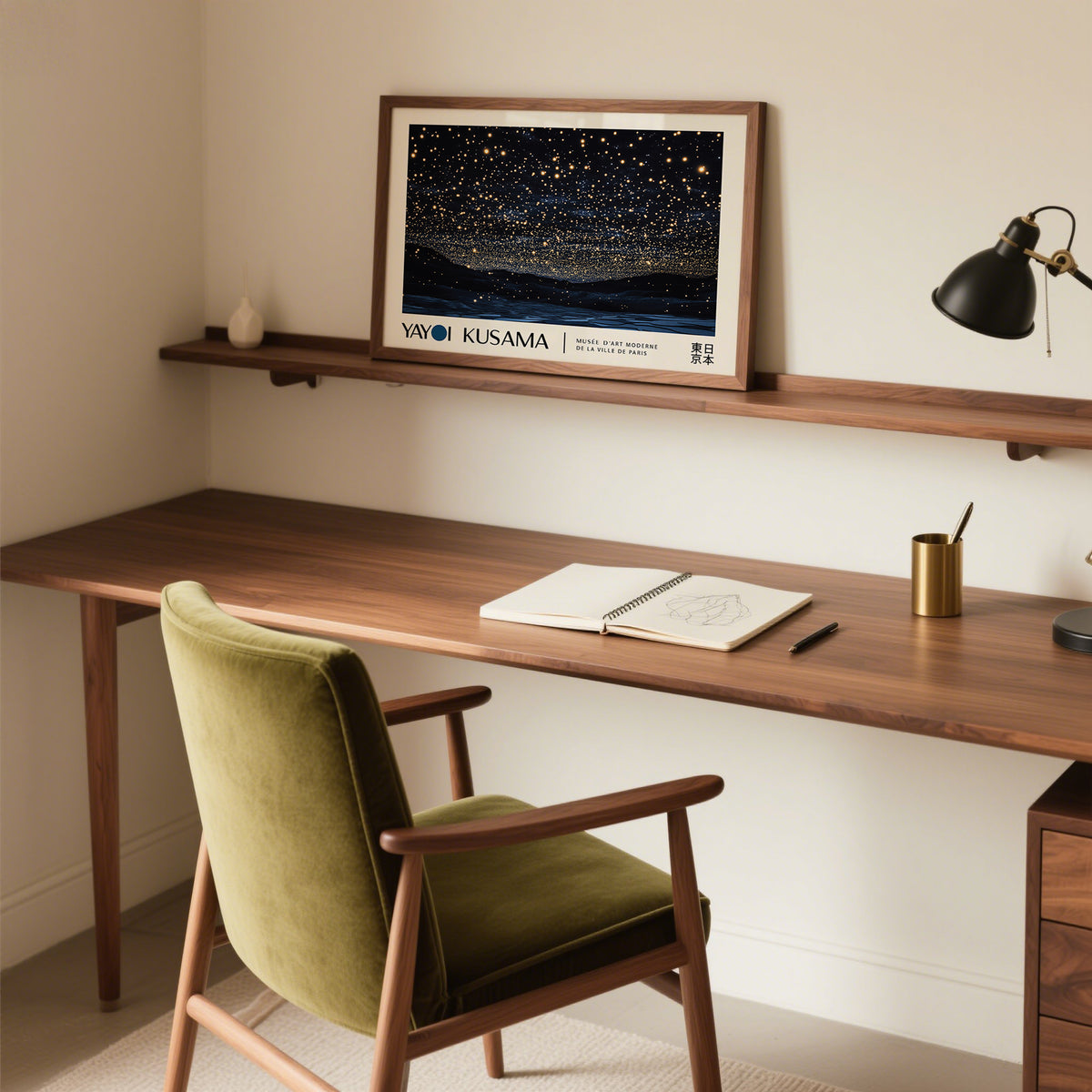 Night Sky Art print leaning on a wooden shelf above a desk with an olive green chair