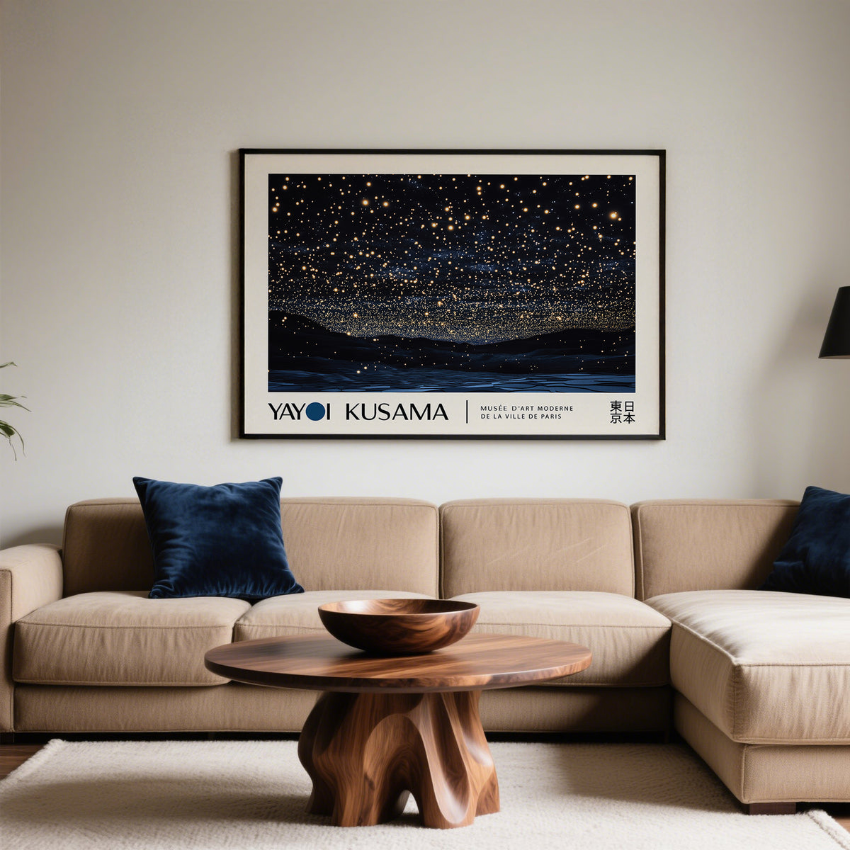 Night Sky Art photographic print of starry night sky in black frame above beige sofa with blue cushions