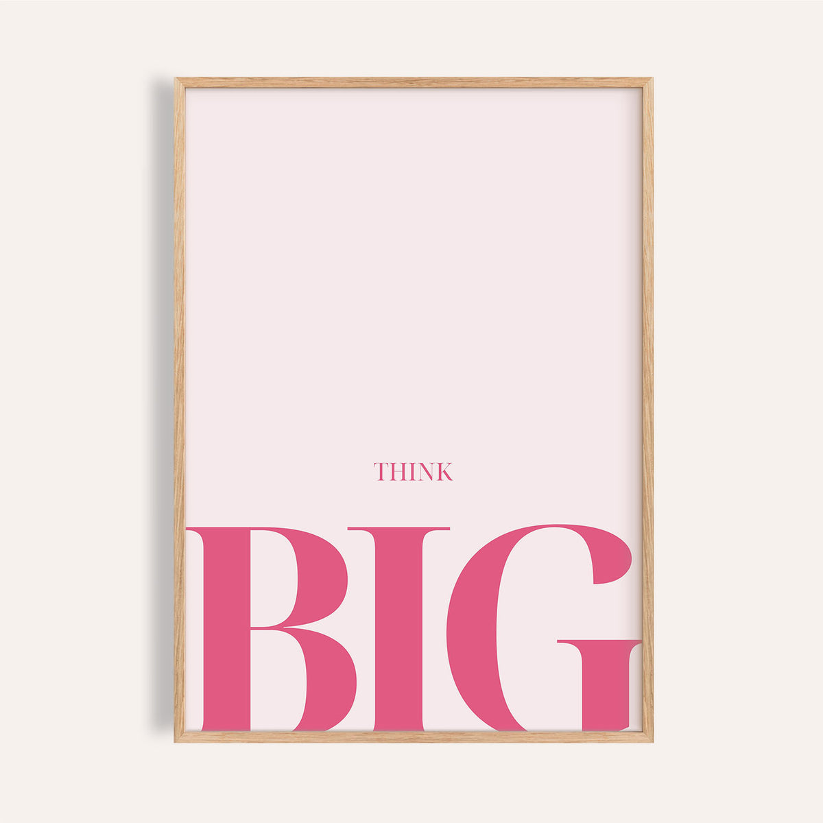Framed close-up of think big typography with pink letters on pale background