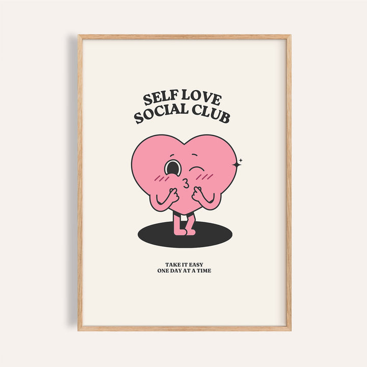 Framed inspirational quotes wall decor with a pink winking heart character and black text on cream background