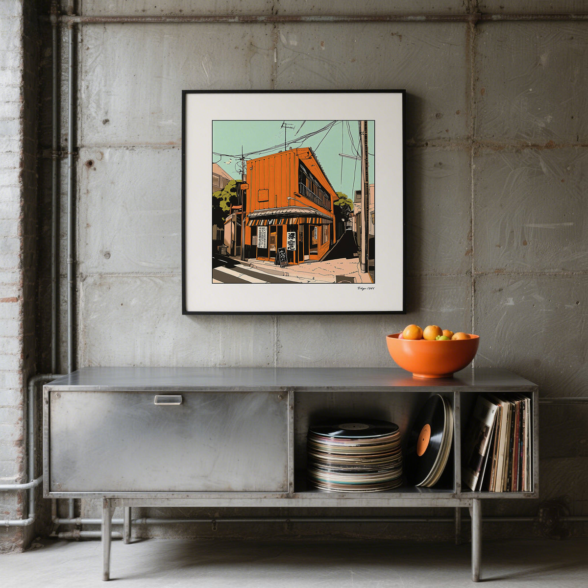 Tokyo wall art of an orange street building in contemporary style above a metal sideboard with orange bowl