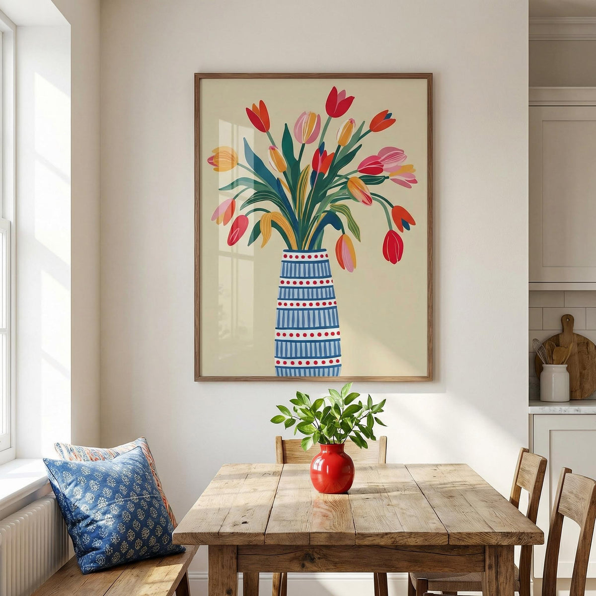 Floral Vase Art print with colourful tulips in a patterned blue vase above a dining table with a red vase and green plant