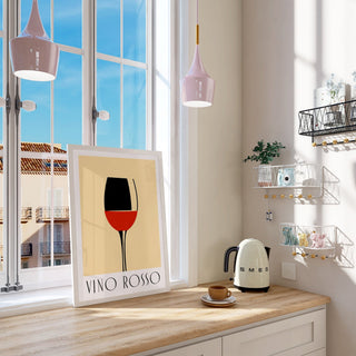 Print leaning on a shelf featuring modern wine wall art of a red wine glass with minimalist typography in a bright kitchen