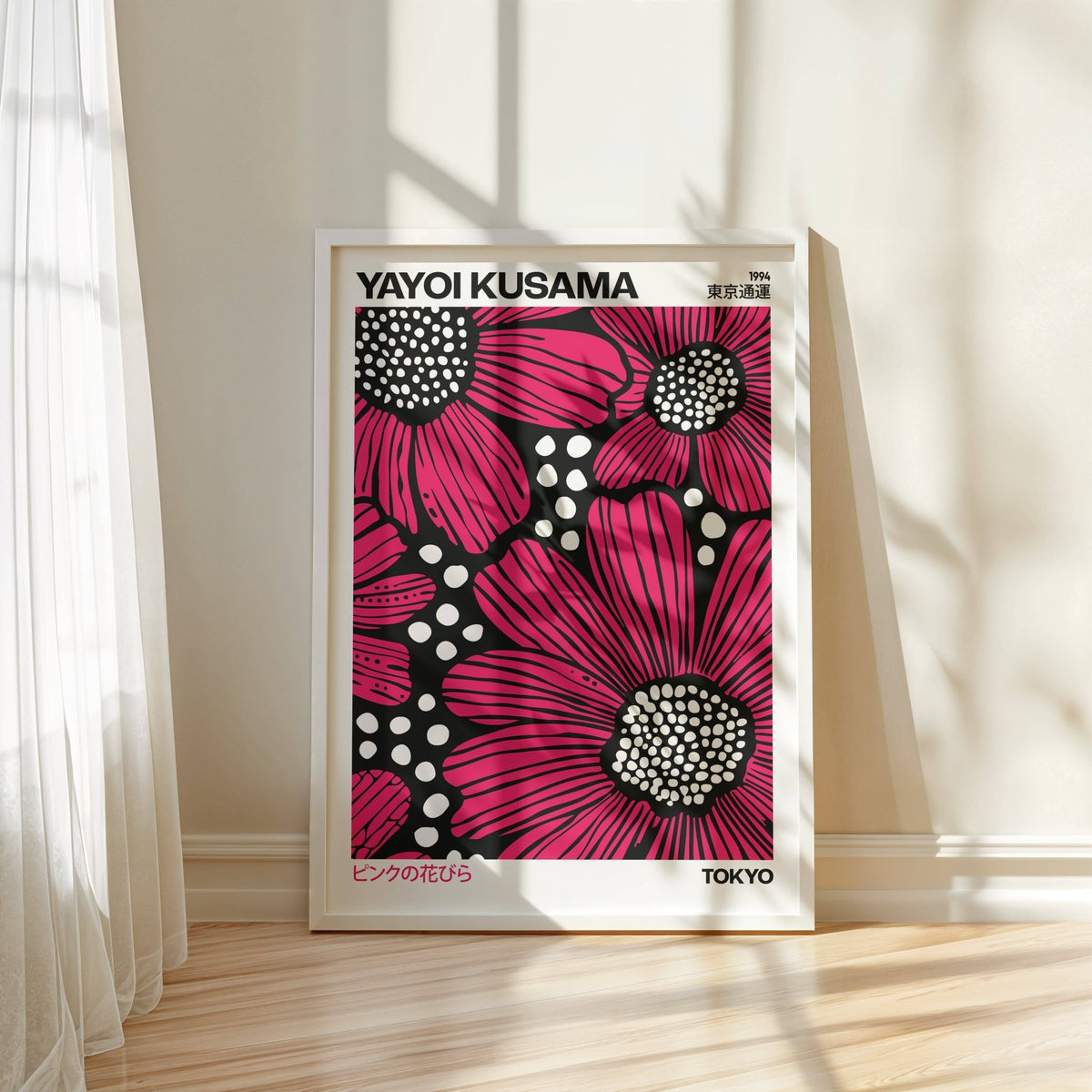 Pink Posters framed print of red daisies with white spots leaning on a floor by a wall with sunlight