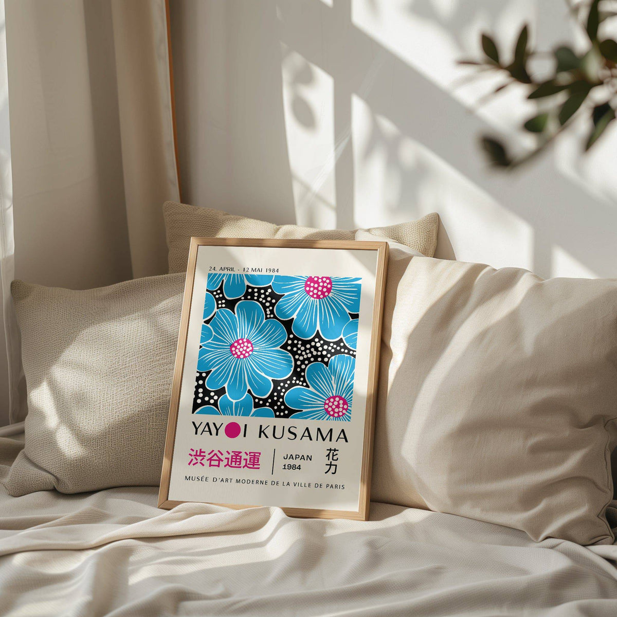 Framed Large Modern Floral wall art with blue and pink flowers on a beige cushioned background