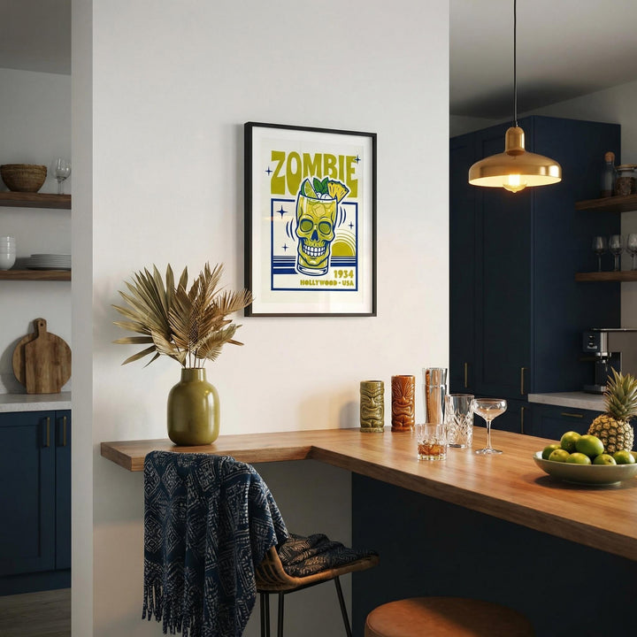 Zombie Cocktail Art Print in black frame above wooden bar with glassware and green vase in kitchen