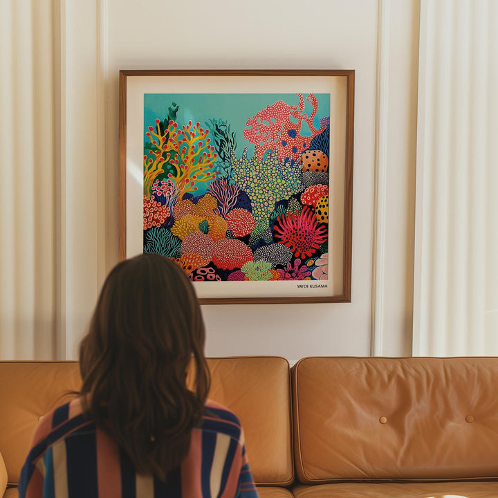 Tropical Sea wall art of a colourful coral reef scene above a brown leather sofa with curtains