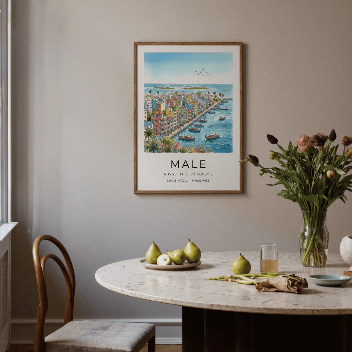 Maldives City Art Print framed print on a wall above a dining table with green pears and flowers