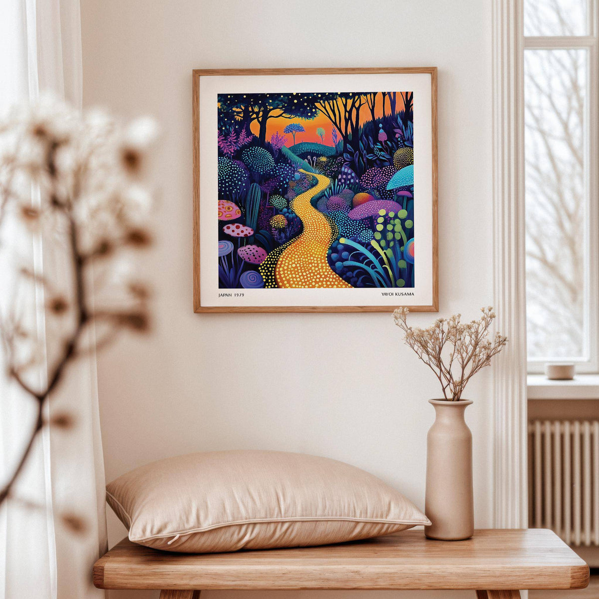 Polka Dot Pop Art hanging above a wooden table with beige cushions and a vase with dried flowers