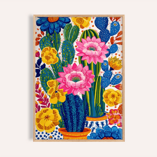 Framed close-up of colorful botanical wall art with pink and yellow flowering cacti
