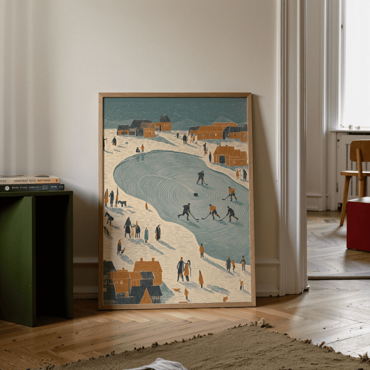 Print leaning on floor of Winter ice hockey game illustration with beige and teal colours and a stack of books nearby