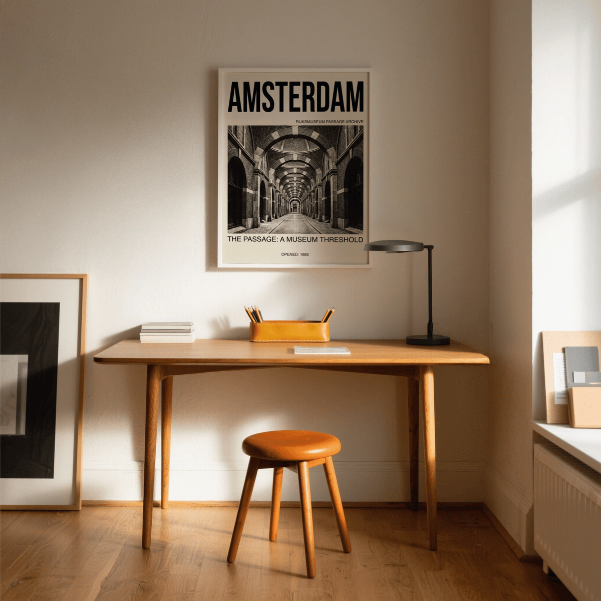 Amsterdam Passage wall art with a black and white archway passage above a wooden desk and stool