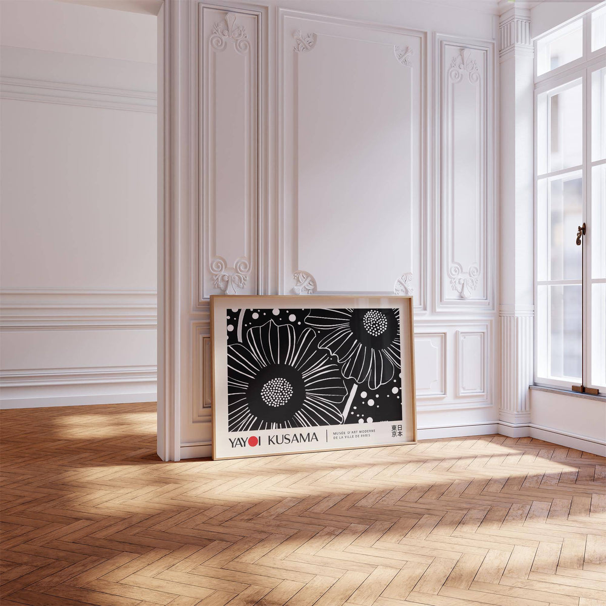Horizontal wall hanging of black and white flowers leaning on a parquet floor in a bright room with ornate walls