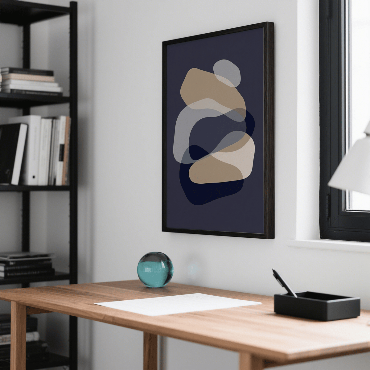 Abstract Art Shapes wall art with overlapping beige and navy shapes above a wooden desk