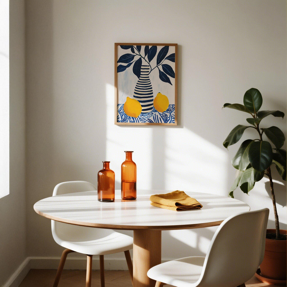 Lemon art print of striped vase with lemons and blue leaves above a dining table with amber bottles