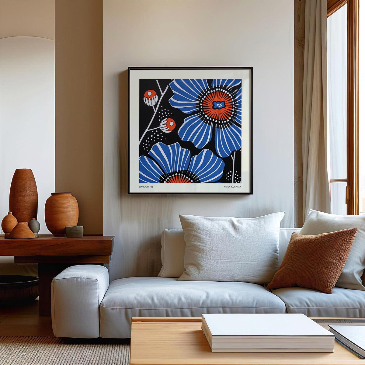 Flowers prints blue poppy flower in blue and orange framed print above sofa with cushions