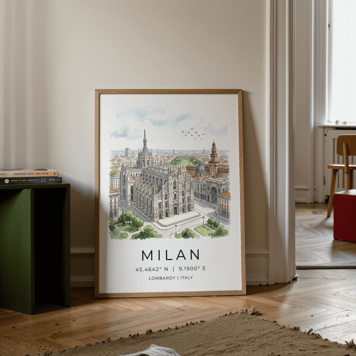 Print leaning on floor of Milan Cathedral art print with watercolour cityscape and soft blue sky near chair