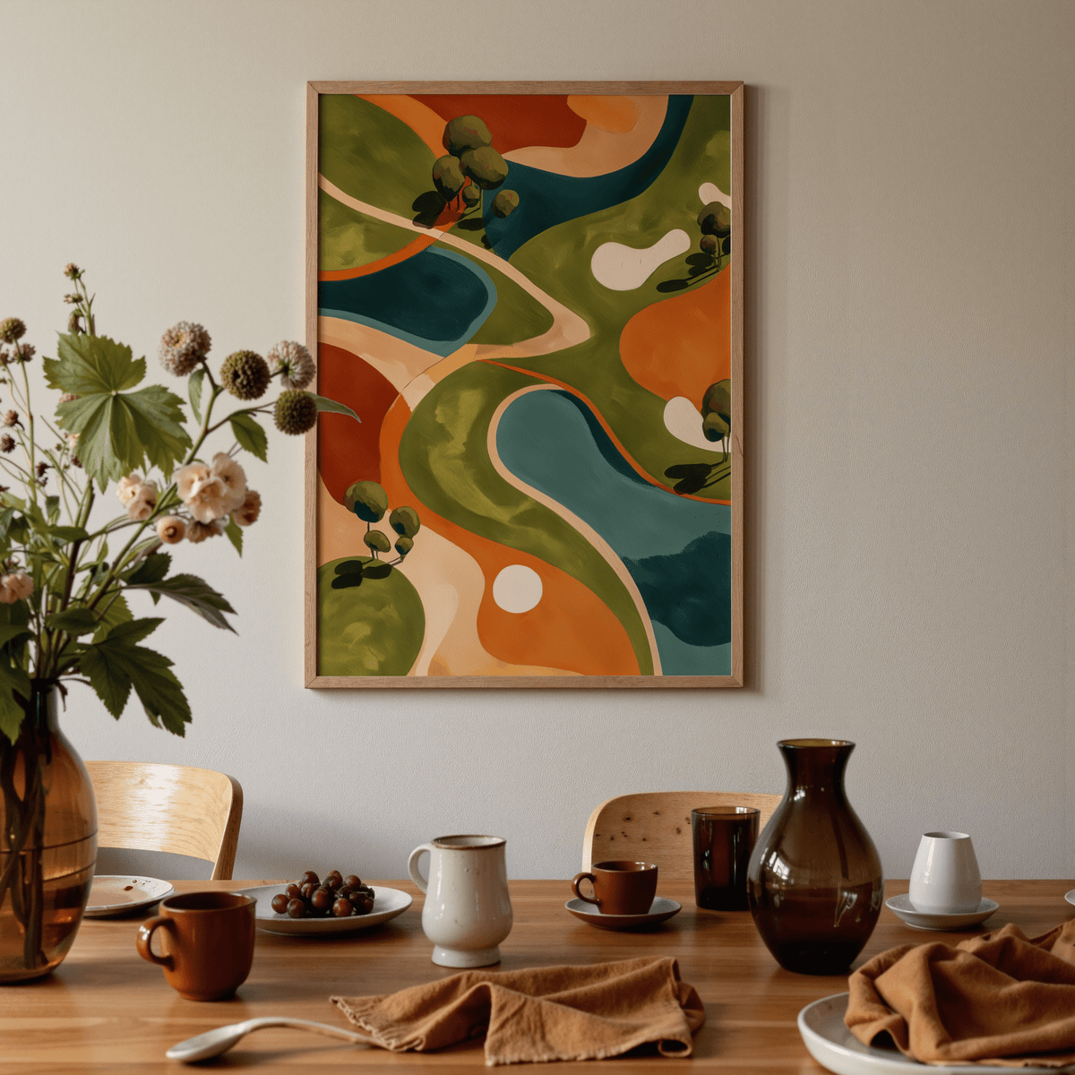 Golf Abstract wall art in green and orange hues above a dining table with crockery and a flower vase