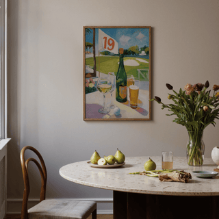 Watering Hole Golf Art Print on a dining room wall above a white marble table with pears and flowers