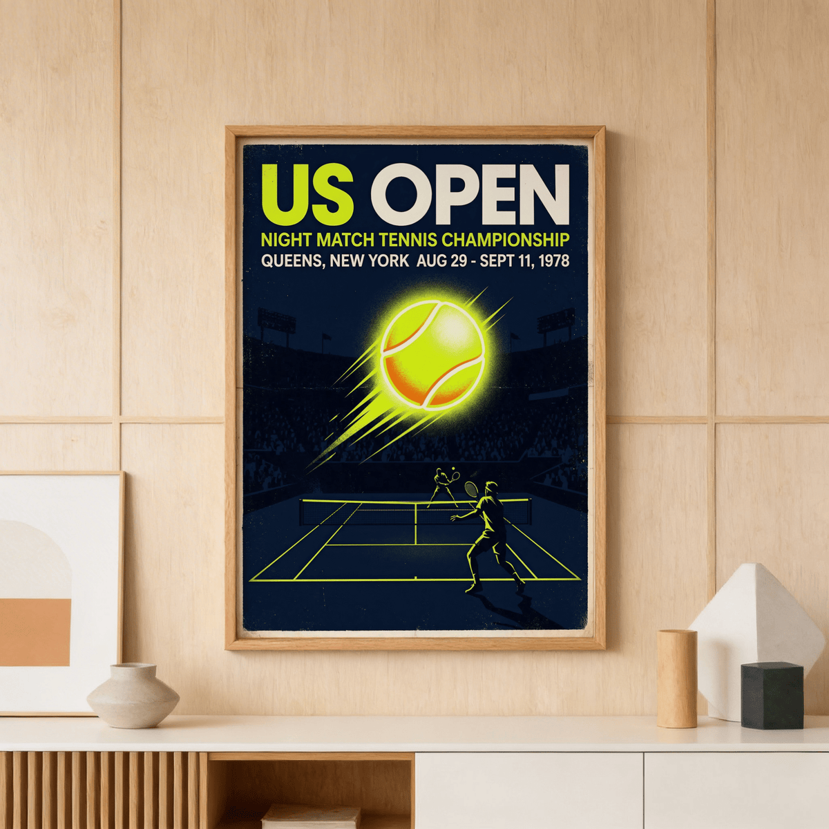 Print of New York Tennis Championship poster in a wooden frame above a wooden sideboard with vases
