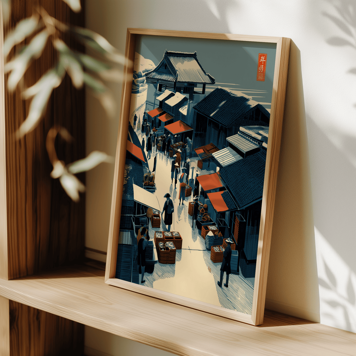 Print leaning on a shelf with Asian Market wall art in blue and red tones with sunlight and plant shadows