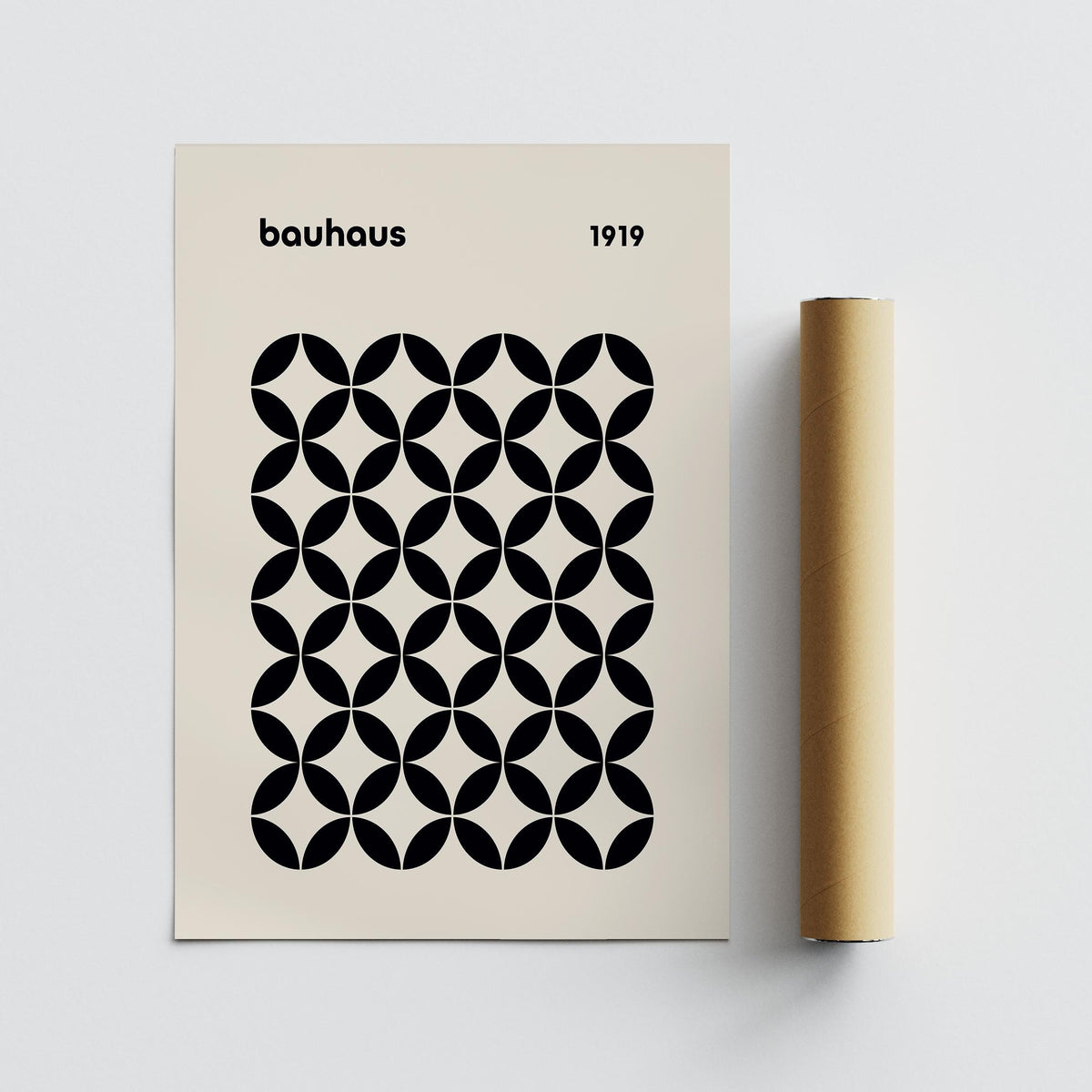 Mid Century Wall Print with black geometric grid on cream background beside a packaging tube
