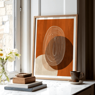 Modern Geometric Print leaning on a window ledge with a cup and flowers nearby