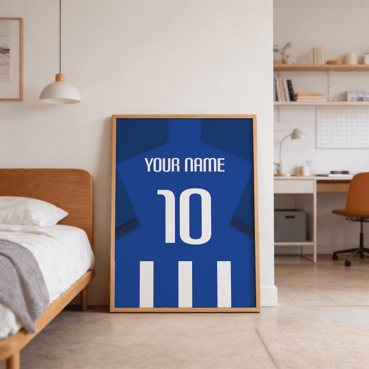 Football Shirt Poster in Blue and White Stripes with Dark Blue Sleeves leaning on floor by a wooden bed frame