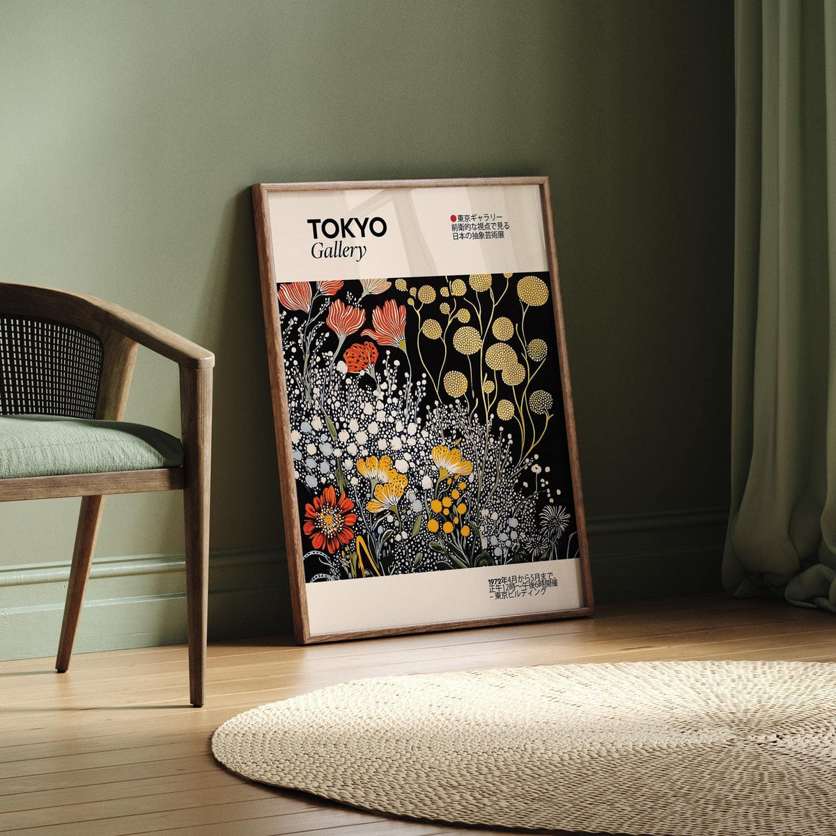 Vintage Japanese wall art print leaning on wooden floor against green wall with chair nearby