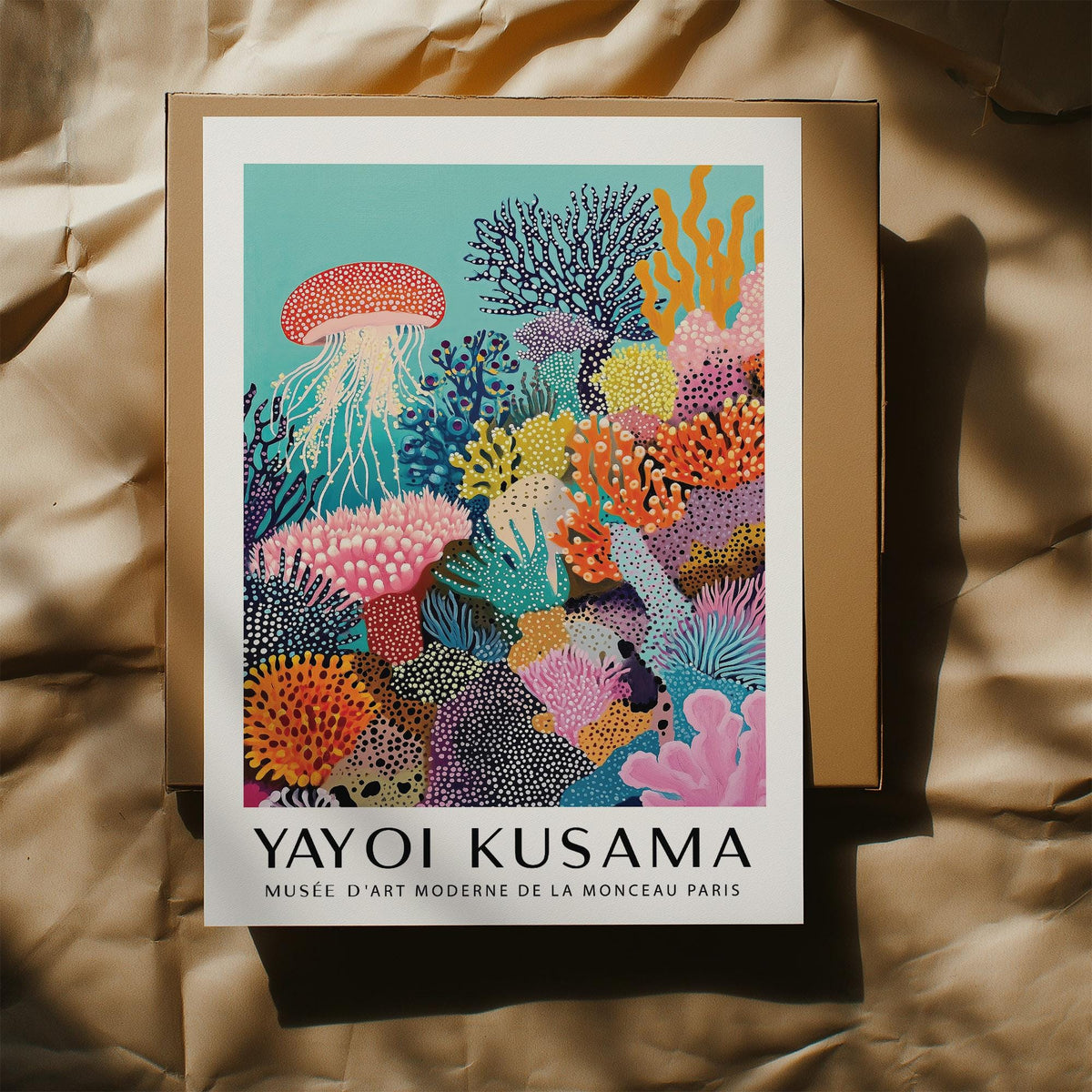 Coral Reef Art print with jellyfish and colourful coral details lying on a brown box under sunlight