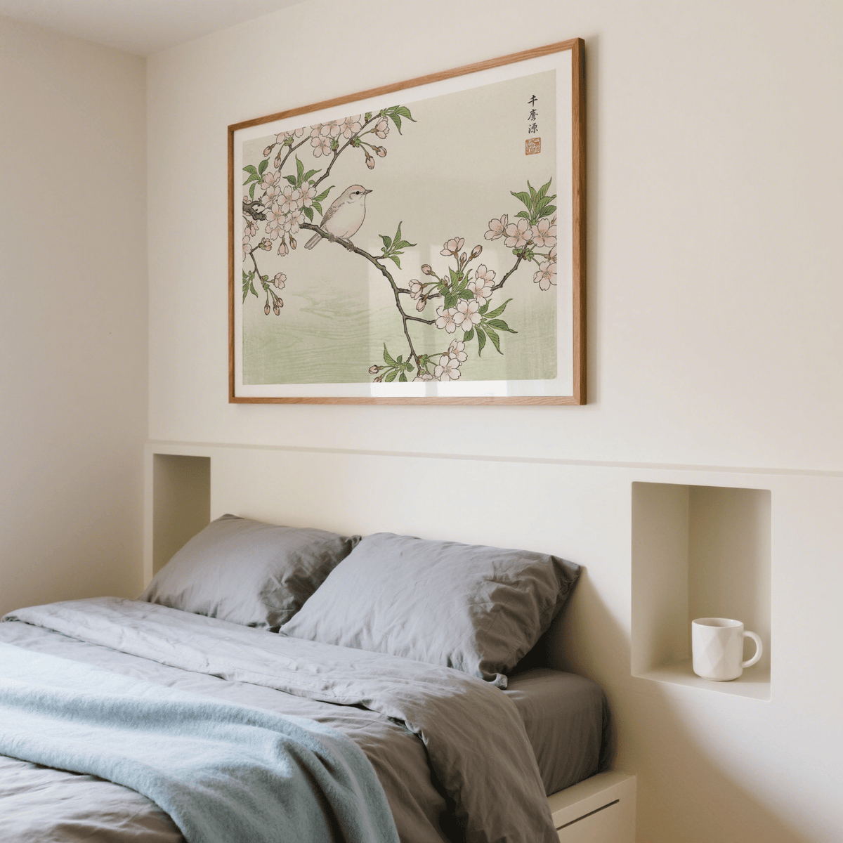 Bird Cherry Blossom Art Print above a double bed with grey bedding in a cream bedroom