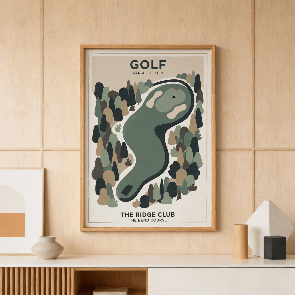 Golf landscape print of minimalist golf course hole in green and beige hung above a sideboard